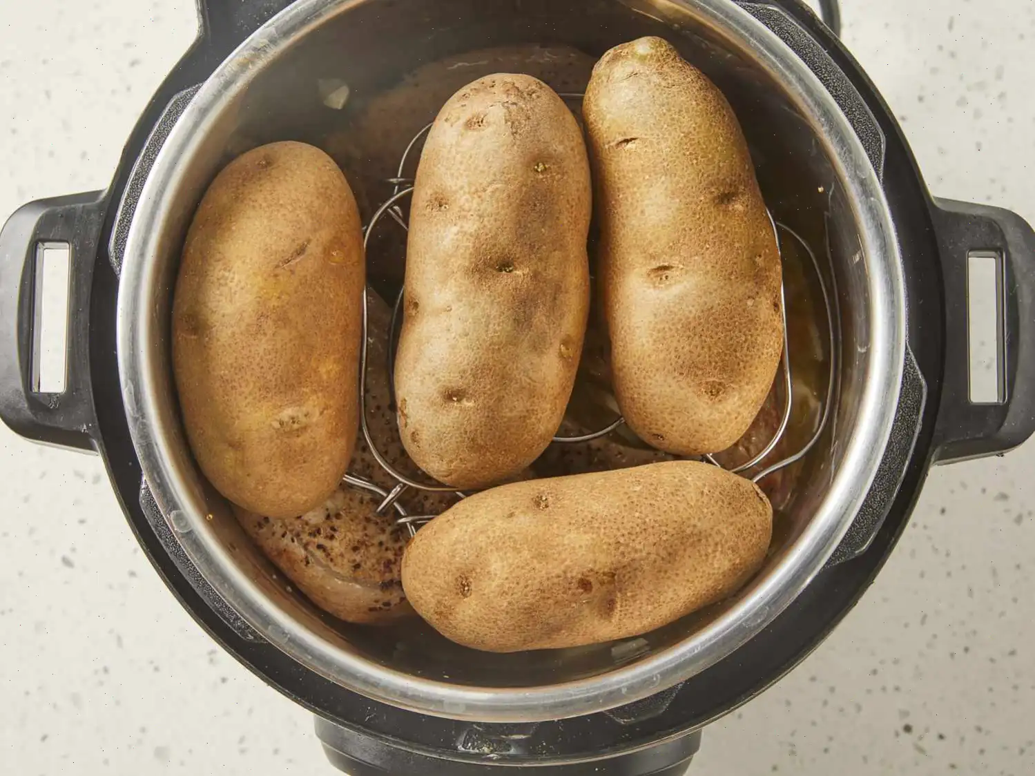 Pressure Cooker Bone-In Pork Chops, Baked Potatoes, and Carrots Recipe